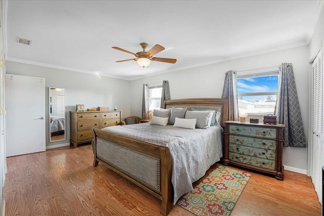 bedroom featuring wood-type flooring, ceiling fan, and crown molding