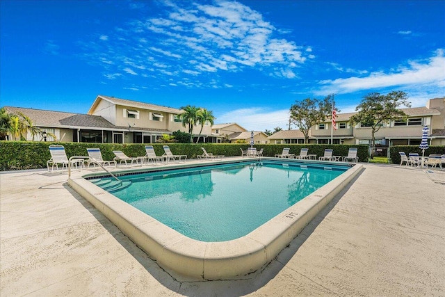 view of swimming pool with a patio area