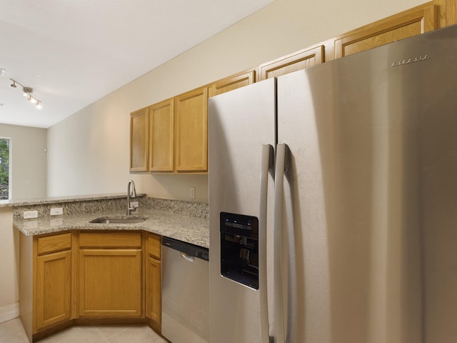 773 Pipers Cay Dr, West Palm Beach, FL 33415 - kitchen with appliances with stainless steel finishes, a sink, a peninsula, light stone countertops, and rail lighting