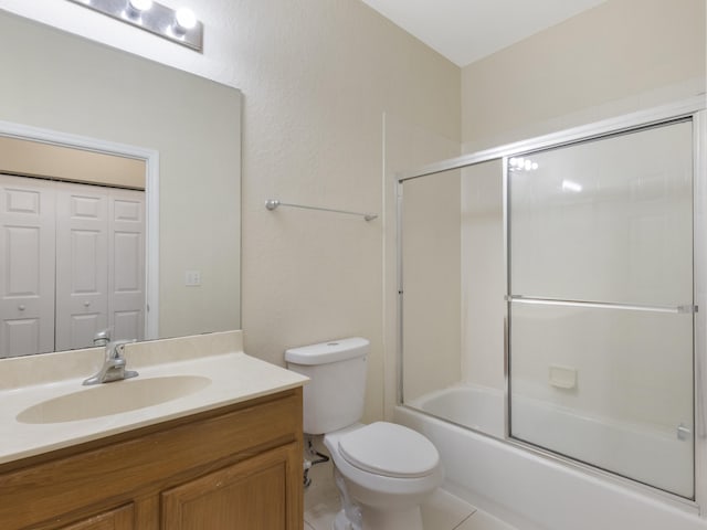 773 Pipers Cay Dr, West Palm Beach, FL 33415 - bathroom with vanity, toilet, and bath / shower combo with glass door