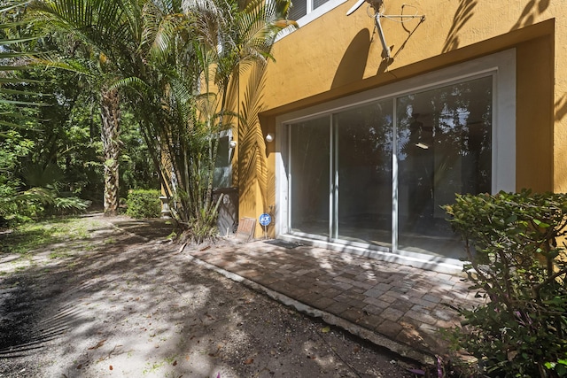 property entrance with a patio