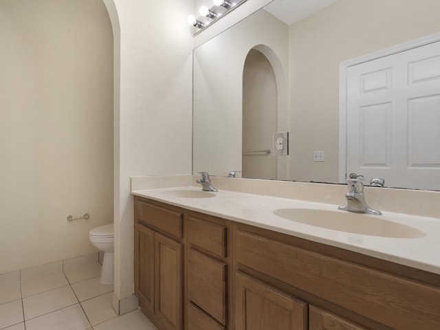 773 Pipers Cay Dr, West Palm Beach, FL 33415 - bathroom featuring tile patterned floors, double vanity, and toilet