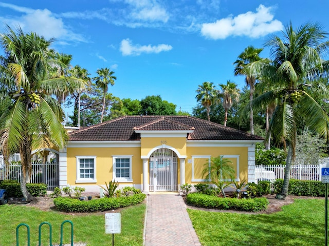 773 Pipers Cay Dr, West Palm Beach, FL 33415 - mediterranean / spanish house with a tiled roof and stucco siding