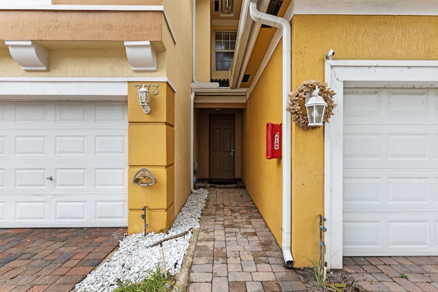 property entrance with a garage