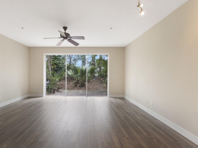 773 Pipers Cay Dr, West Palm Beach, FL 33415 - spare room with dark wood-style floors, a ceiling fan, and baseboards