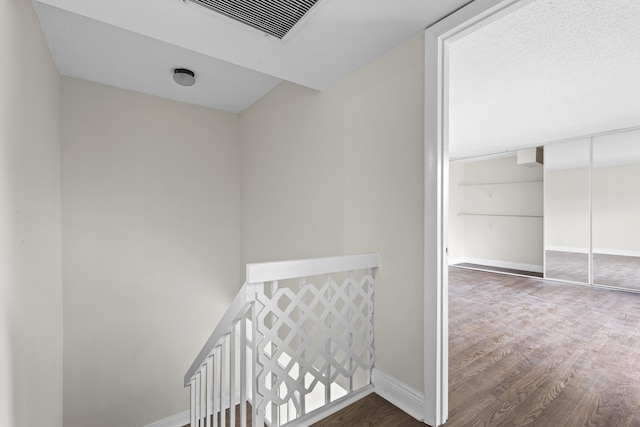 corridor featuring dark hardwood / wood-style flooring