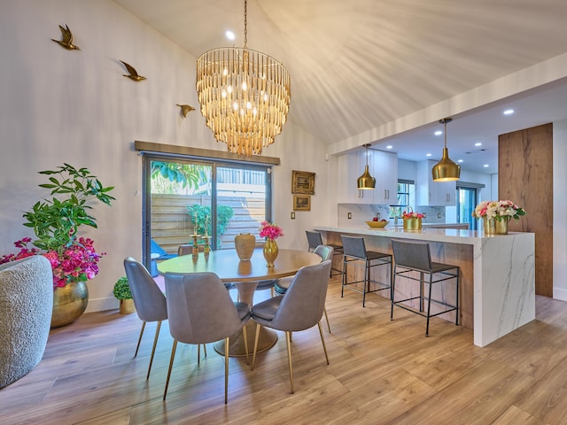 dining area featuring a wealth of natural light and light hardwood / wood-style flooring