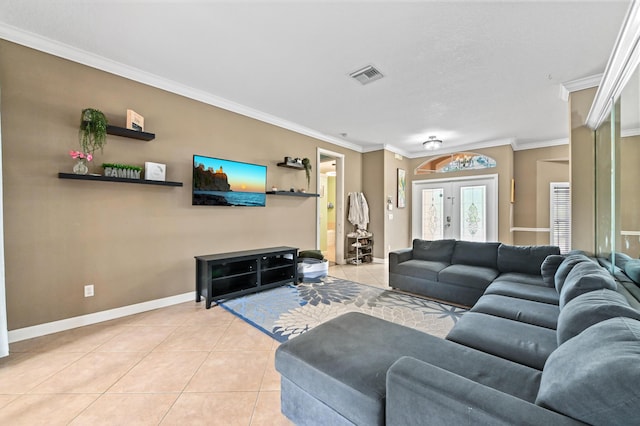 tiled living room featuring french doors and ornamental molding