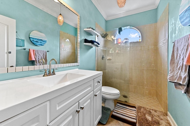 bathroom featuring crown molding, tiled shower, vanity, and toilet