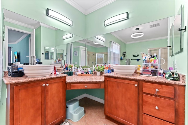 bathroom featuring vanity, tile patterned flooring, a shower with shower door, and ornamental molding