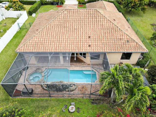 view of swimming pool featuring an in ground hot tub and a lanai