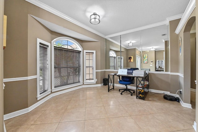 home office featuring light tile patterned floors, crown molding, and a textured ceiling