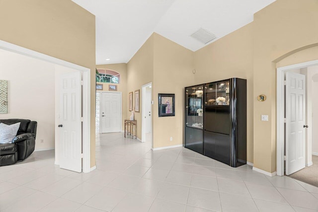 hall with light tile patterned floors