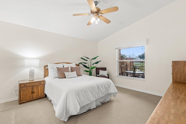 carpeted bedroom with lofted ceiling and ceiling fan