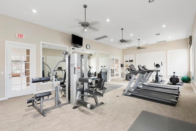 gym featuring light carpet, french doors, and ceiling fan