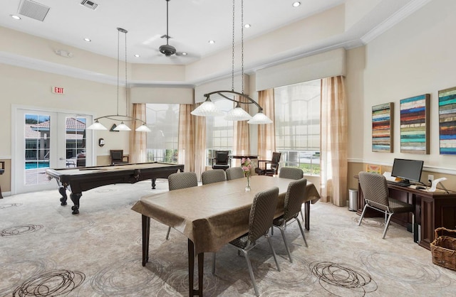 dining room with french doors, light carpet, and a high ceiling