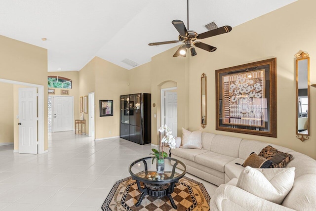 tiled living room with high vaulted ceiling and ceiling fan