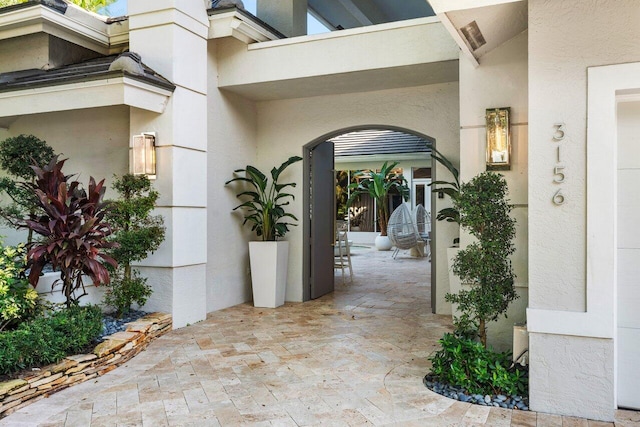 doorway to property with a patio area