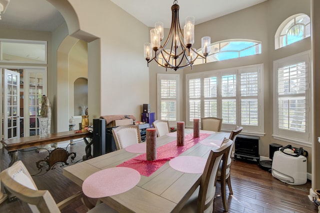 dining area featuring dark hardwood / wood-style flooring and a healthy amount of sunlight