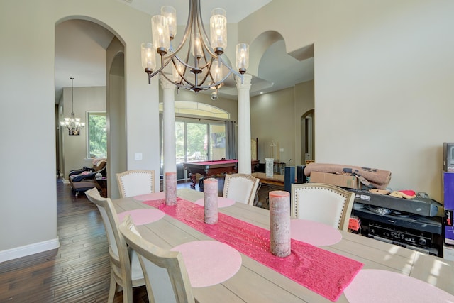 dining room featuring an inviting chandelier and dark hardwood / wood-style floors