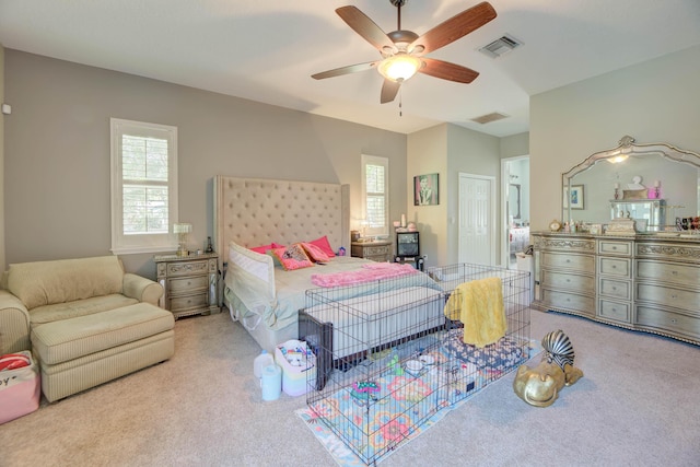 bedroom with light colored carpet and ceiling fan