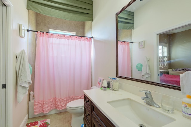 full bathroom featuring tile patterned flooring, vanity, shower / tub combo, and toilet