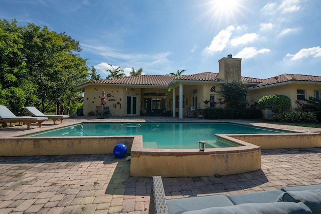 view of swimming pool with a patio area