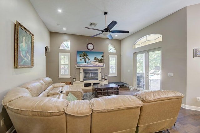 living room featuring hardwood / wood-style floors, french doors, and ceiling fan