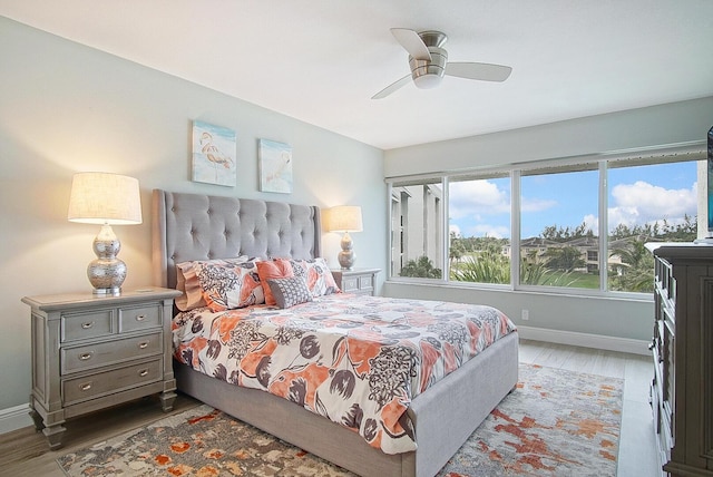 bedroom featuring hardwood / wood-style floors and ceiling fan