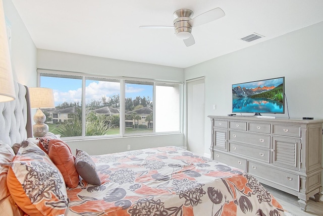 bedroom featuring ceiling fan and light hardwood / wood-style flooring