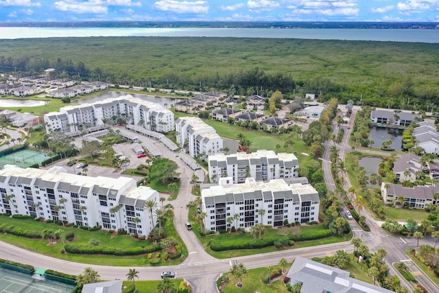 birds eye view of property featuring a water view