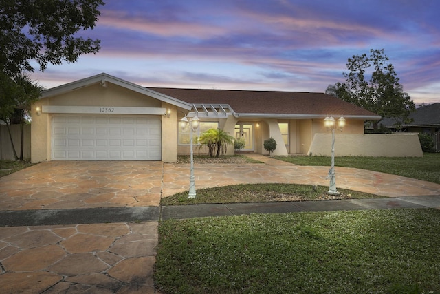 single story home with a garage