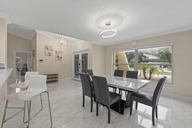 dining room with crown molding and a notable chandelier