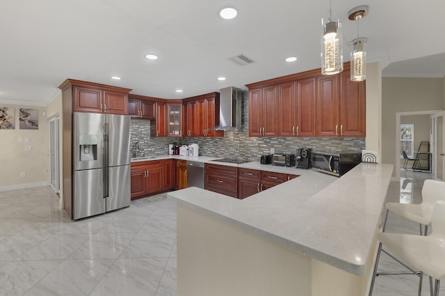 kitchen with appliances with stainless steel finishes, decorative light fixtures, ornamental molding, kitchen peninsula, and wall chimney range hood