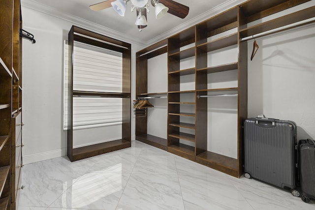 spacious closet featuring radiator heating unit and ceiling fan