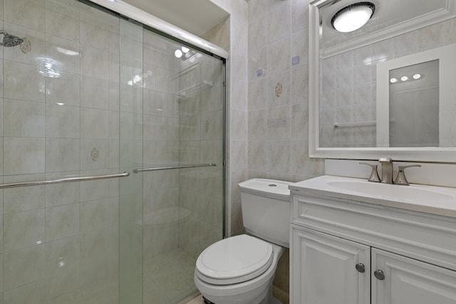 bathroom featuring a shower with shower door, tile walls, vanity, toilet, and crown molding