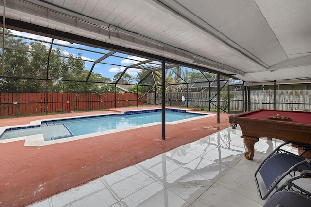 view of swimming pool with a patio and glass enclosure