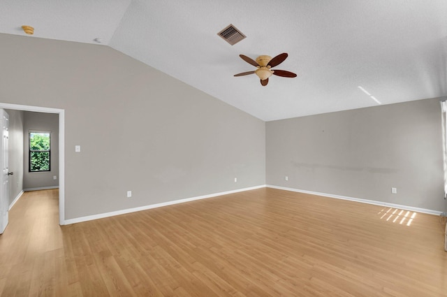 3215 NW 12th St, Delray Beach, FL 33445 - empty room with lofted ceiling, a ceiling fan, light wood-style floors, and baseboards