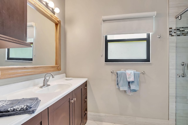 3215 NW 12th St, Delray Beach, FL 33445 - full bath with a tile shower, vanity, tile patterned floors, and baseboards