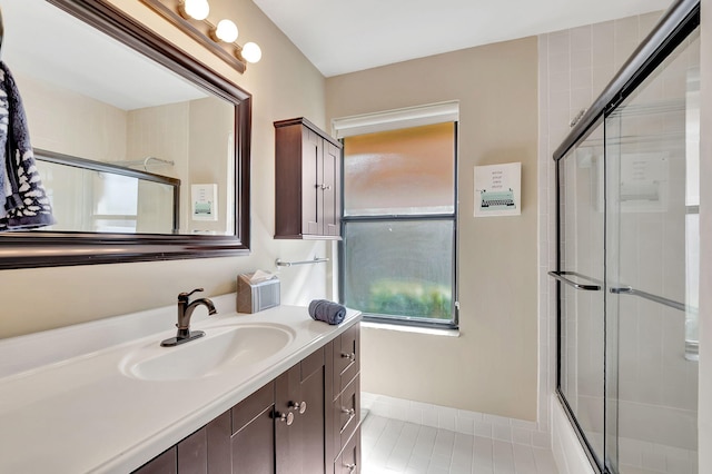 3215 NW 12th St, Delray Beach, FL 33445 - full bath featuring a shower with shower door, vanity, tile patterned floors, and baseboards