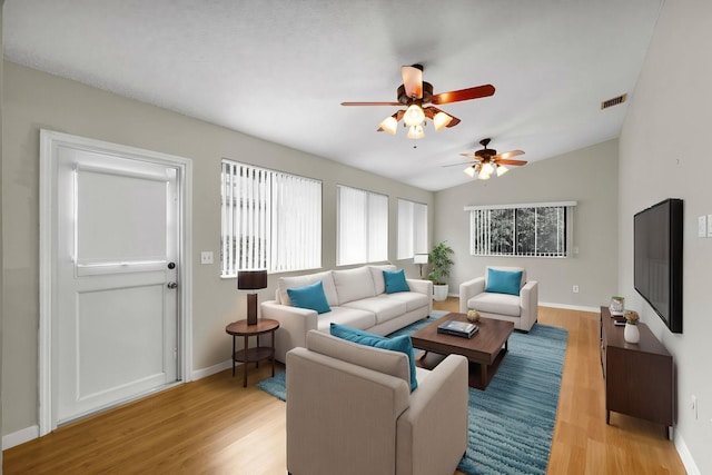 3215 NW 12th St, Delray Beach, FL 33445 - living room featuring light wood-style floors, ceiling fan, baseboards, and lofted ceiling