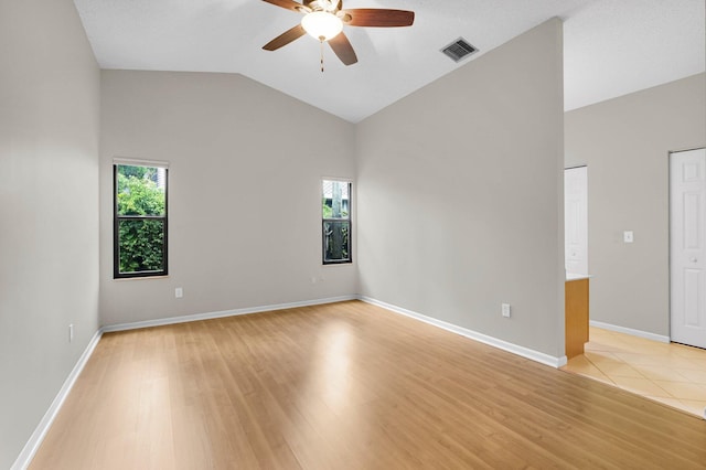 3215 NW 12th St, Delray Beach, FL 33445 - unfurnished room featuring ceiling fan, light wood-style floors, high vaulted ceiling, and baseboards