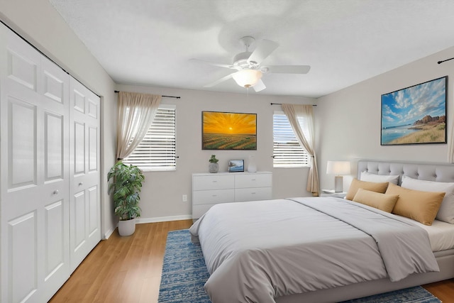 3215 NW 12th St, Delray Beach, FL 33445 - bedroom featuring a closet, light wood-style flooring, baseboards, and a ceiling fan