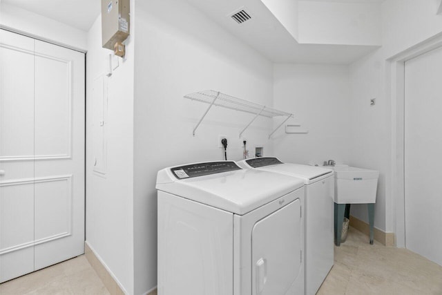 laundry room with washing machine and clothes dryer