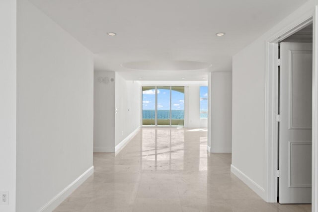 hallway featuring floor to ceiling windows