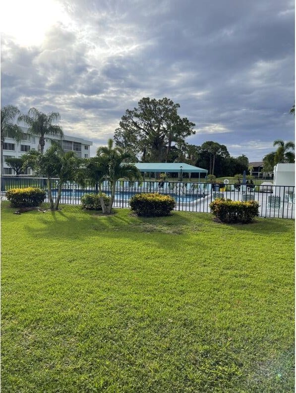 view of yard featuring a community pool