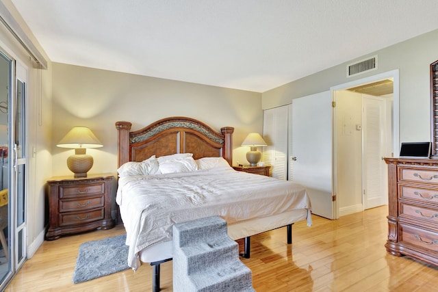 bedroom featuring a closet and light hardwood / wood-style flooring