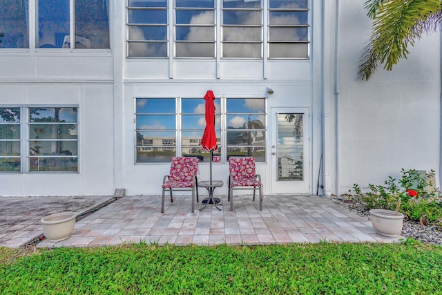 property entrance featuring a patio