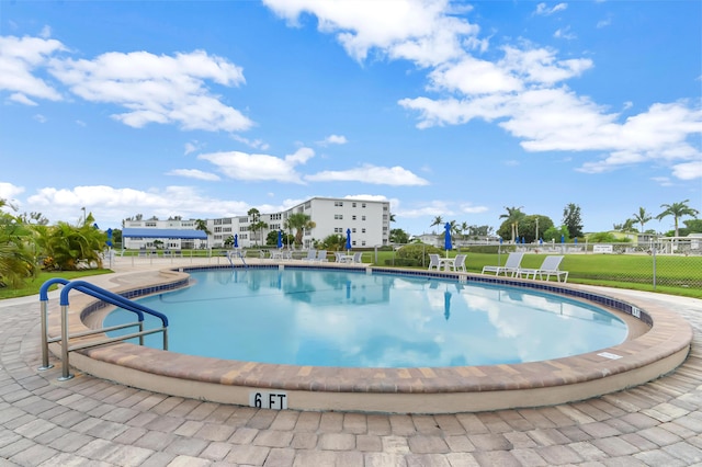 view of swimming pool featuring a patio area