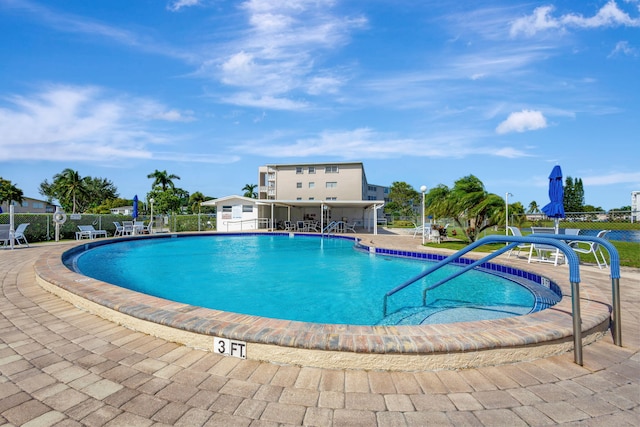 view of swimming pool featuring a patio